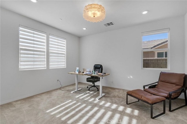 office area with light colored carpet