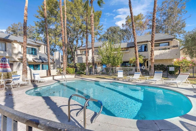 view of swimming pool with a patio