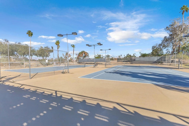 view of sport court with basketball hoop