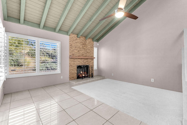 unfurnished living room featuring a fireplace, high vaulted ceiling, ceiling fan, and light tile patterned flooring