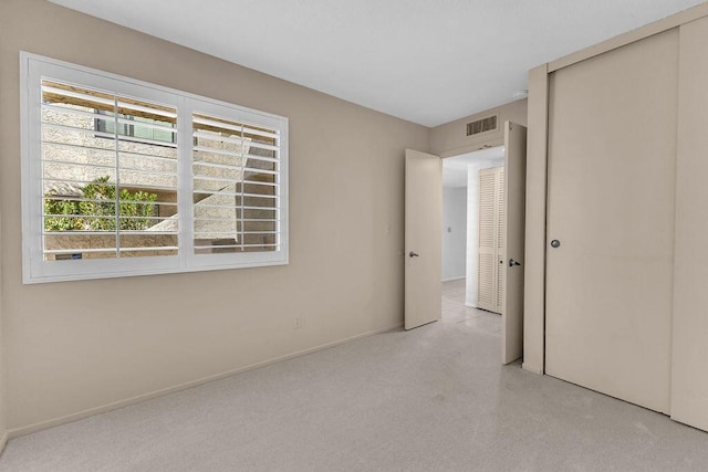 unfurnished bedroom with a closet