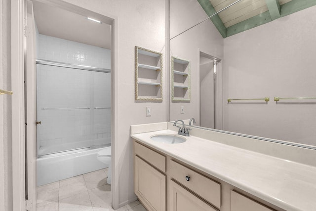 full bathroom with tile patterned floors, combined bath / shower with glass door, vanity, and toilet