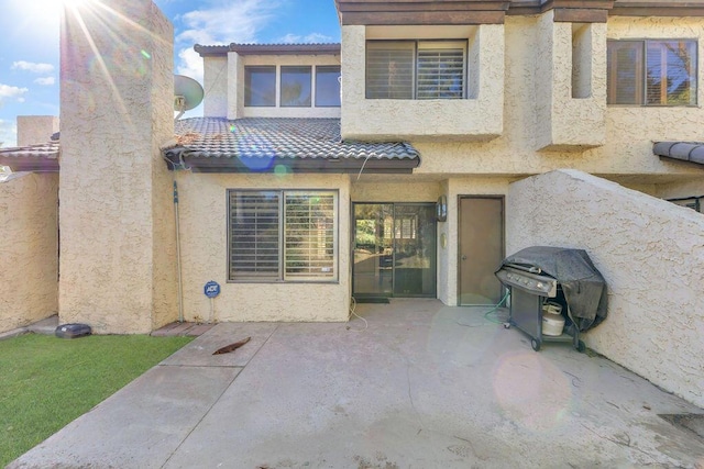 rear view of house with a patio area