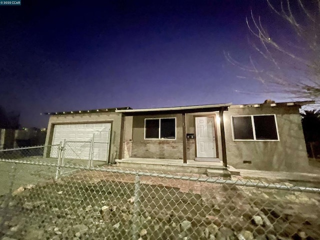 view of front of property featuring a garage