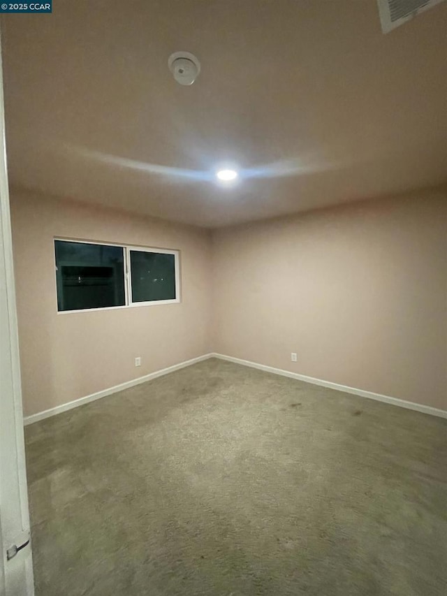 empty room featuring carpet flooring