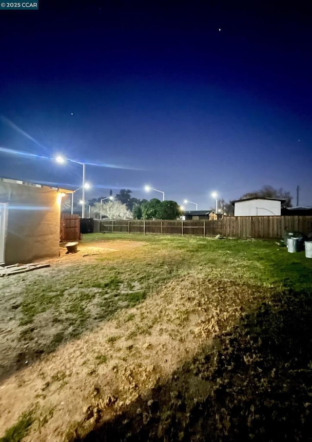 view of yard at night