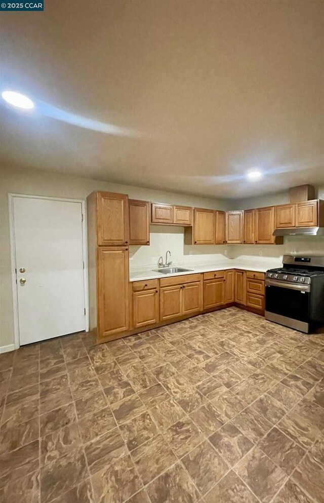 kitchen with stainless steel gas stove and sink