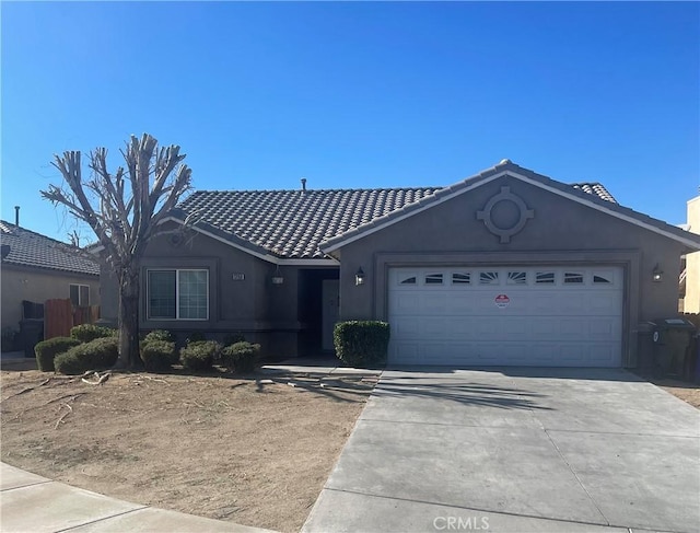 ranch-style house featuring a garage