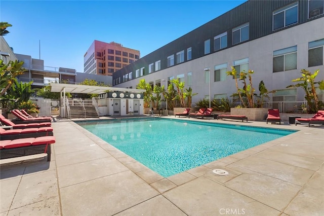 view of swimming pool featuring a patio