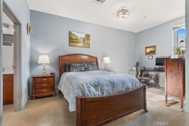 bedroom featuring ensuite bathroom