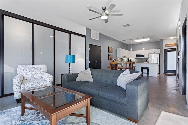 living room with ceiling fan