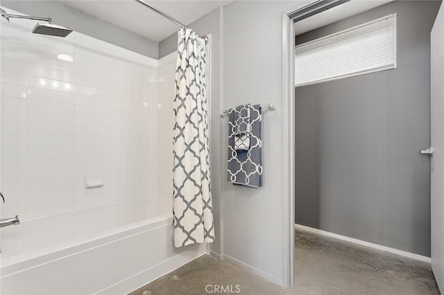 bathroom with shower / bath combo with shower curtain and concrete floors