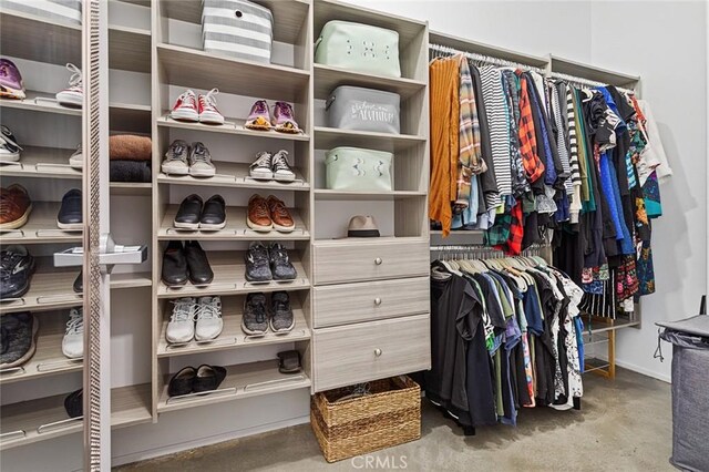 walk in closet with carpet