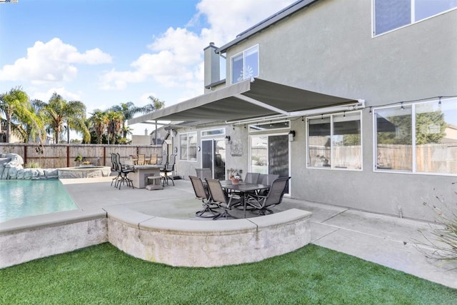 exterior space with a bar and a swimming pool with hot tub