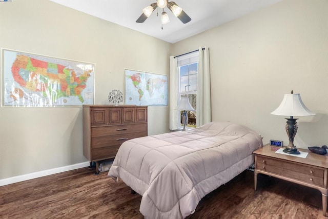 bedroom with ceiling fan and dark hardwood / wood-style floors