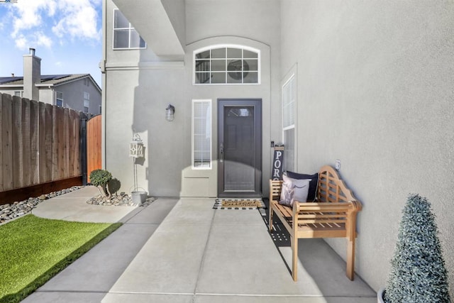 property entrance featuring a patio