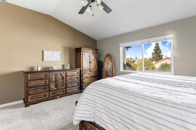 bedroom with carpet flooring, ceiling fan, and vaulted ceiling