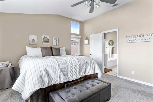 carpeted bedroom with vaulted ceiling, ensuite bathroom, and ceiling fan