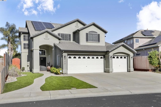 front of property with solar panels and a garage