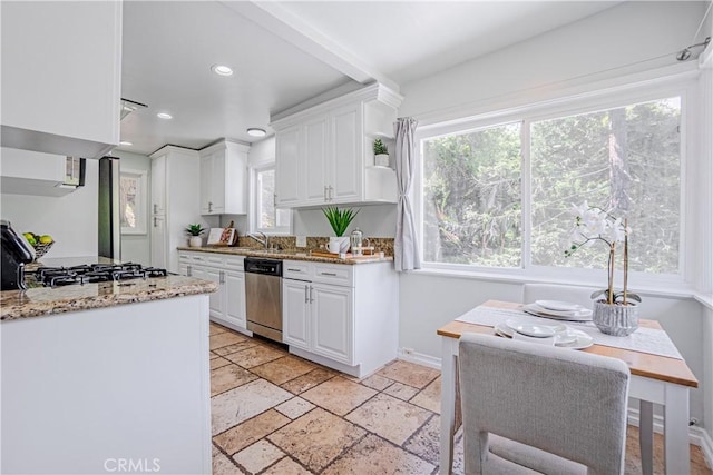 kitchen featuring sink, white cabinets, light stone countertops, and stainless steel appliances