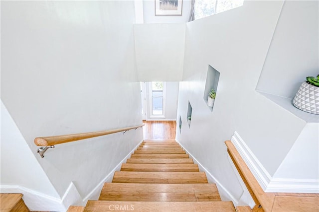 staircase featuring hardwood / wood-style floors