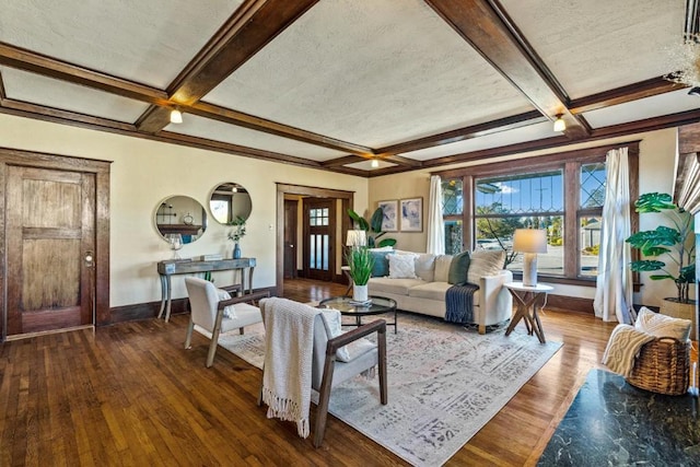 living room with hardwood / wood-style floors, coffered ceiling, a textured ceiling, and beamed ceiling