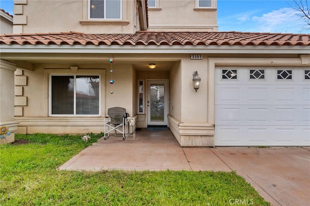 view of exterior entry featuring a garage