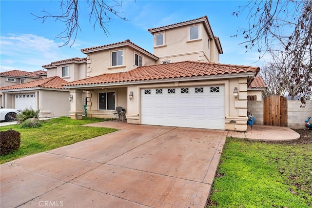 mediterranean / spanish house with a garage and a front lawn