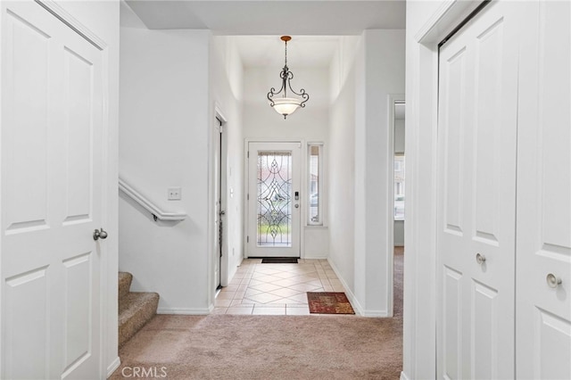 entrance foyer with light colored carpet