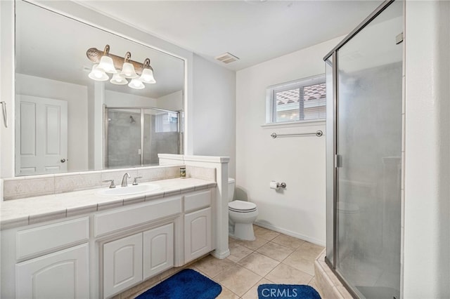 bathroom with toilet, walk in shower, tile patterned floors, and vanity