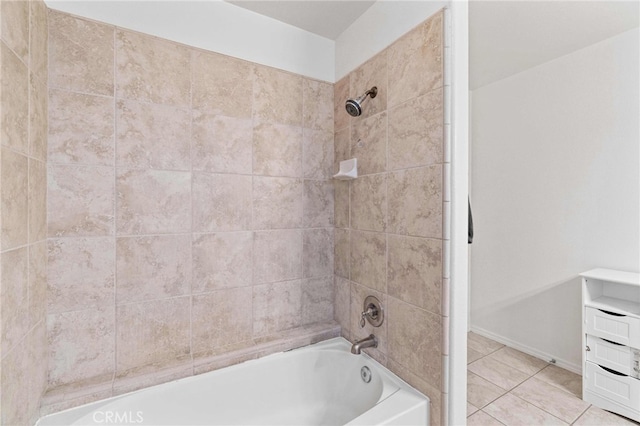 bathroom featuring tiled shower / bath and tile patterned floors