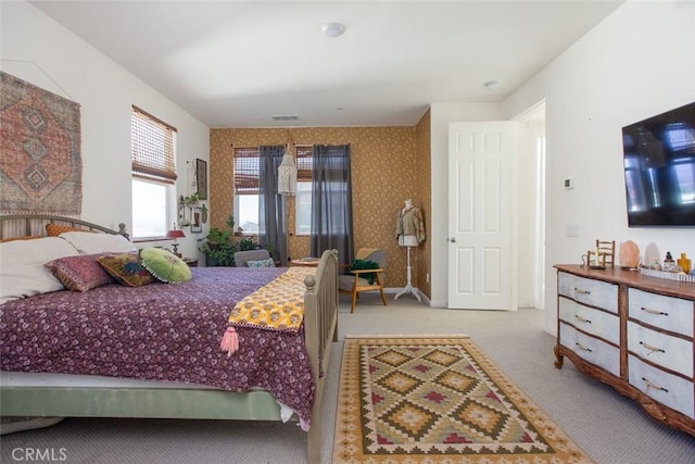 bedroom with light colored carpet