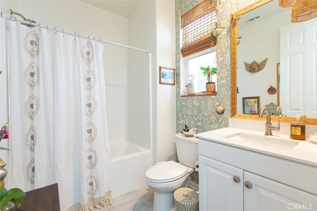 full bathroom with toilet, vanity, and shower / tub combo with curtain