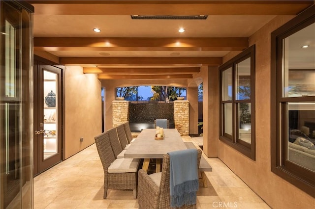 interior space featuring french doors and beamed ceiling