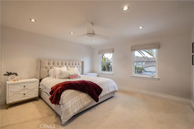 bedroom featuring ceiling fan and light carpet