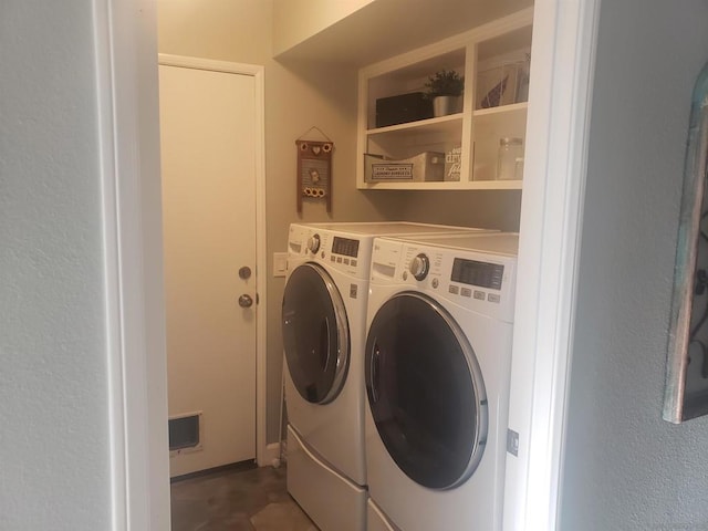 laundry room with separate washer and dryer