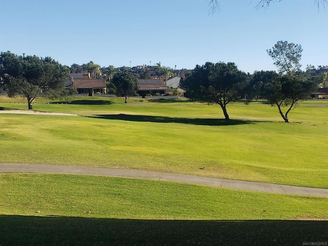 view of home's community featuring a lawn