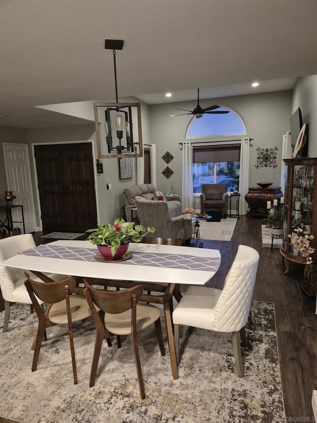 dining room with ceiling fan and hardwood / wood-style flooring