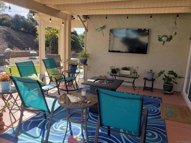 view of patio with an outdoor fire pit