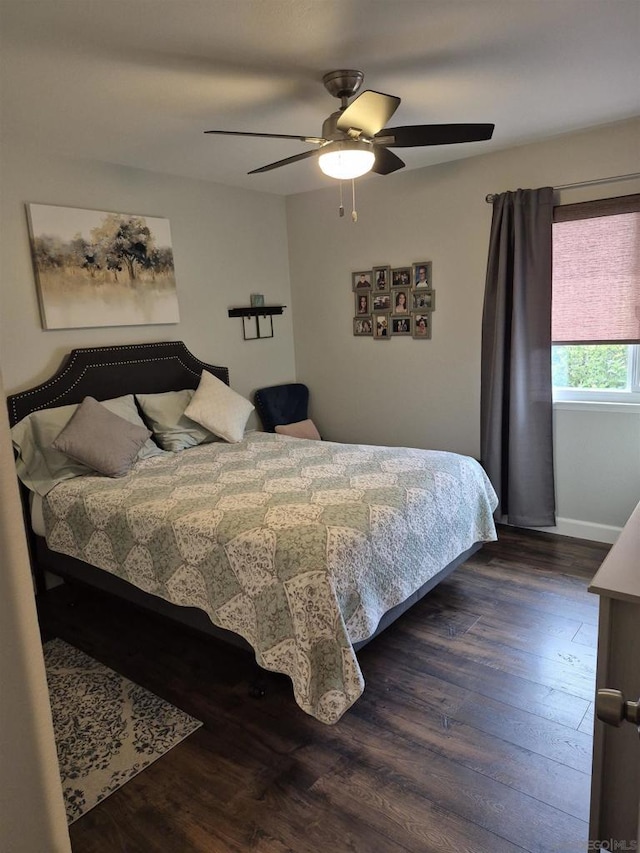 bedroom featuring ceiling fan and dark hardwood / wood-style floors