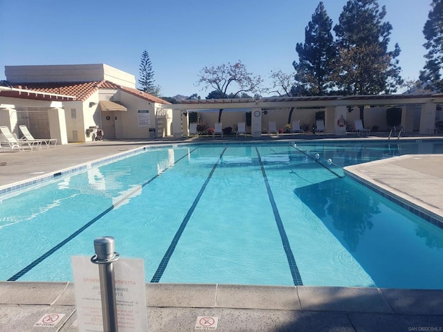 view of swimming pool featuring a patio