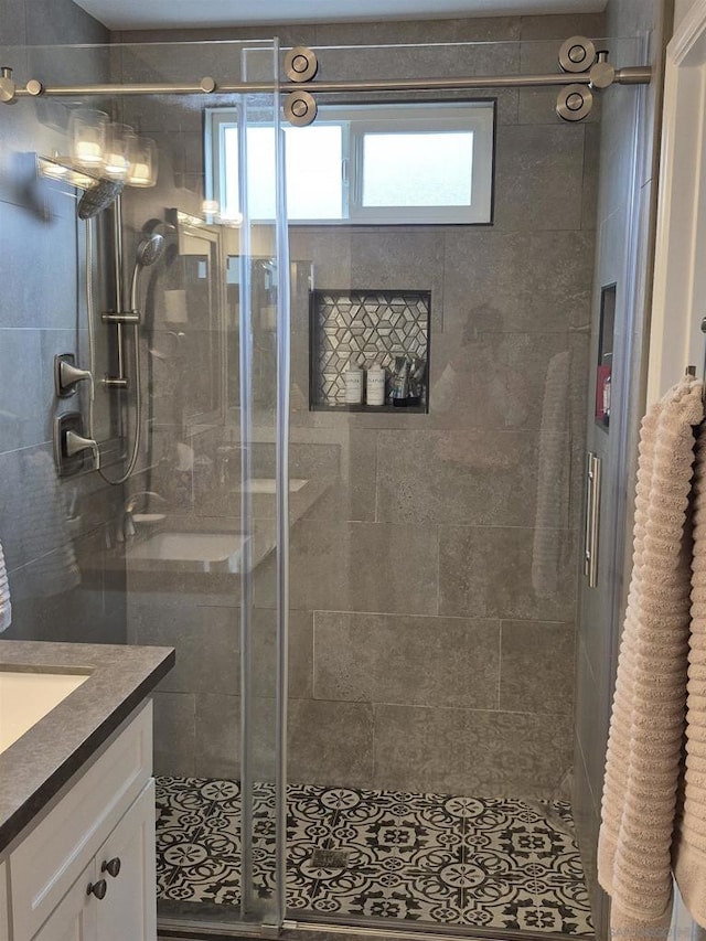 bathroom with an enclosed shower and vanity