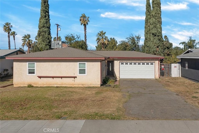 single story home featuring central AC unit, a front lawn, and a garage