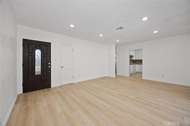 entrance foyer with light hardwood / wood-style flooring