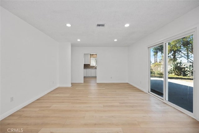 empty room with light wood-type flooring