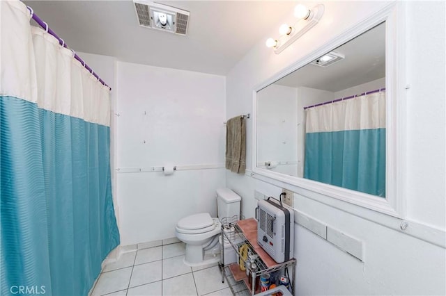 bathroom featuring a shower with curtain, tile patterned floors, and toilet