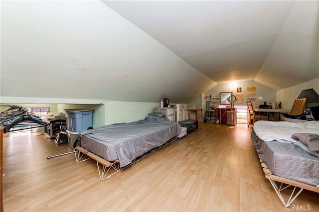 bedroom featuring pool table, light wood-type flooring, and vaulted ceiling