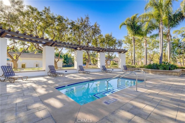 view of pool with a pergola and a patio