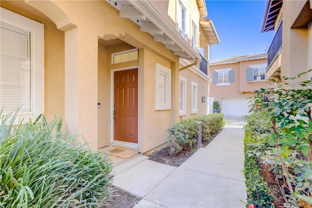 entrance to property featuring a garage