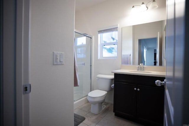 bathroom featuring tile patterned floors, an enclosed shower, vanity, and toilet